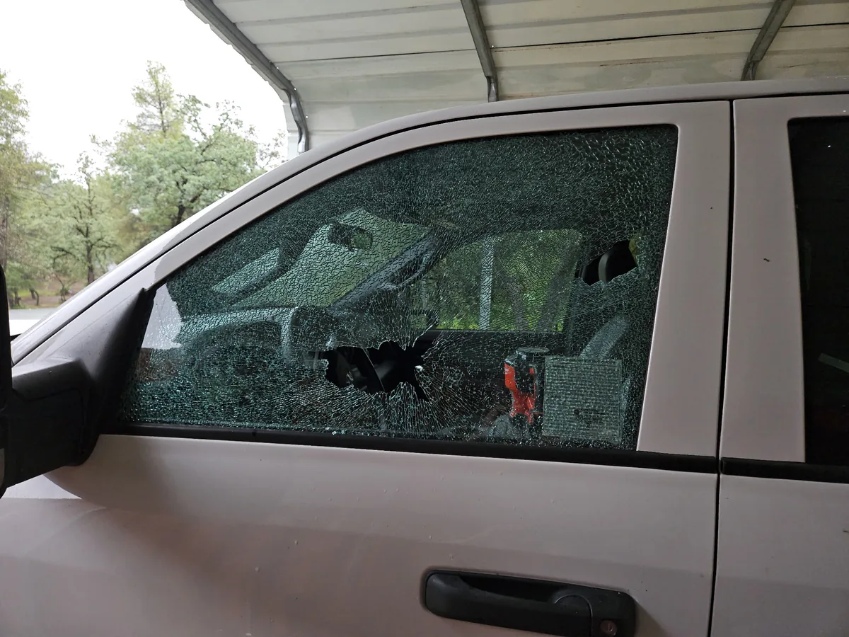 Shattered driver-side door glass on a truck in Lincoln, CA before mobile side window replacement