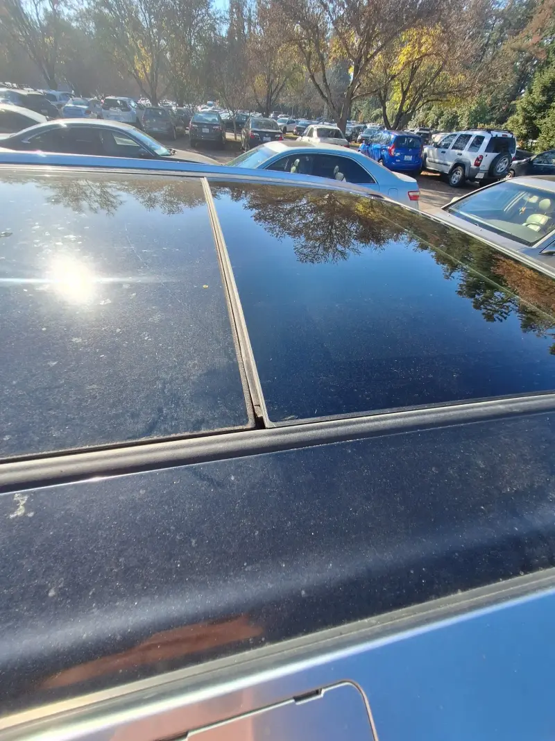 Ford Transit fleet vehicles getting windshield service at commercial lot